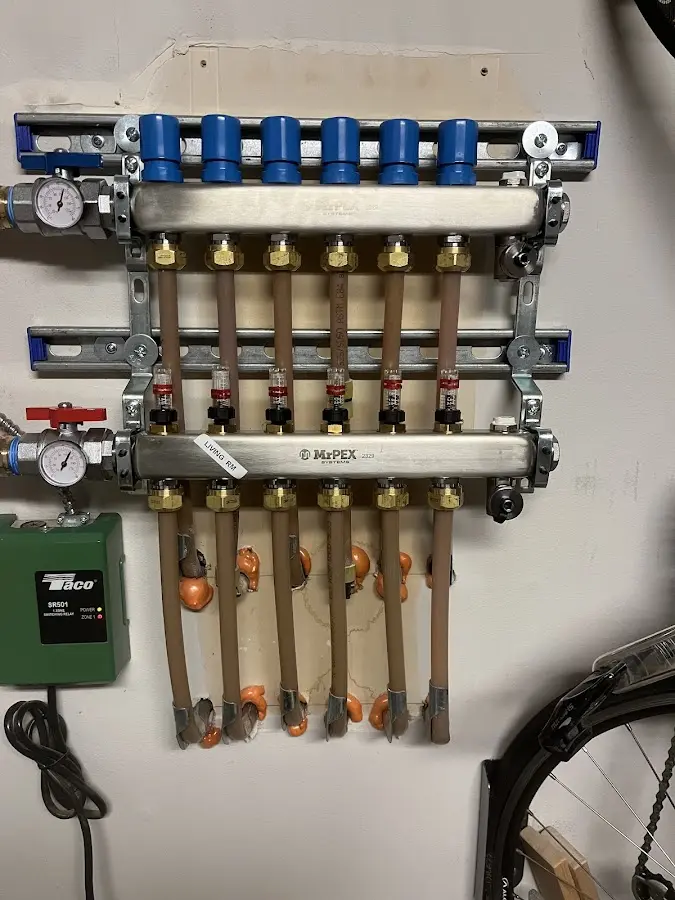 Plumber performing Water Heater Repair at a residential property in Bensville